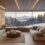 Appartement de luxe au pied des pistes à Megève, salon avec cheminée et vue sur les montagnes enneigées